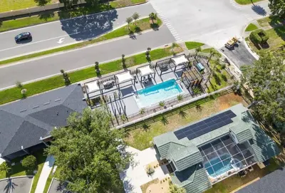 an overhead view of a house with a swimming pool at Tranquil Trail Bungalow in Kissimmee