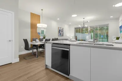 a kitchen with a sink and a counter top at Upstay - Modern Family Townhome with Pool in Orlando