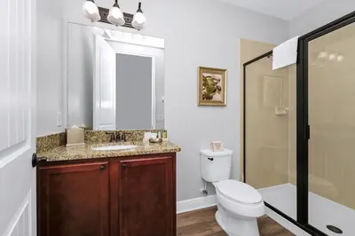 a bathroom with a toilet and a sink and a shower at Grand Home Near Disney With Private Pool And Waterpark & Resort Access At Encore Resorts Reunion - 7519Mr in Kissimmee