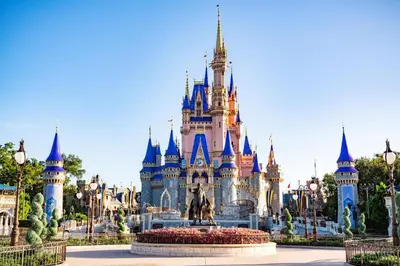 a disney castle in the middle of a park at Disney's Port Orleans Resort - French Quarter in Orlando