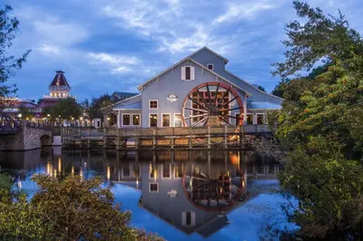 a barn with a watermill on a bridge at Disney's Port Orleans Resort - Riverside in Orlando