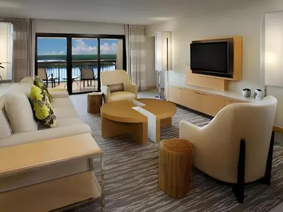 a living room with a couch and a tv at Disney's Contemporary Resort in Orlando