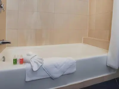 a white bath tub with towels sitting on it at Disney's Contemporary Resort in Orlando