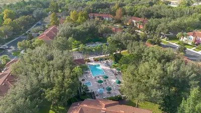 an overhead view of a resort with a swimming pool and trees at Relaxing Getaway in Emerald Island Near Disney in Kissimmee