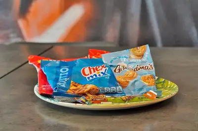 a plate of chips and other snacks on a table at Luxury 12-BR Villa w/ Pool & Resort Amenities Near Disney in Kissimmee