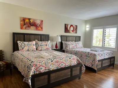 a bedroom with two beds and a window at 15 - Amazing Vulcano Bay - Universal View in Orlando