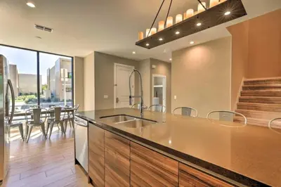 a kitchen with a sink and a dining room at Luxury Magic Village 2mi to Disney TH7501 in Orlando