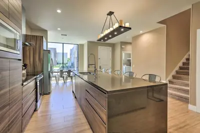 a kitchen with a large island with a counter top at Luxury Magic Village 2mi to Disney TH7501 in Orlando