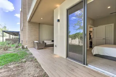 a master bedroom with a bed and a sliding glass door at Luxury Magic Village 2mi to Disney TH7501 in Orlando
