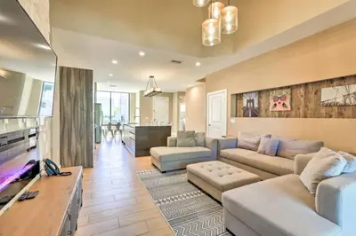 a living room with a couch and a table at Luxury Magic Village 2mi to Disney TH7501 in Orlando
