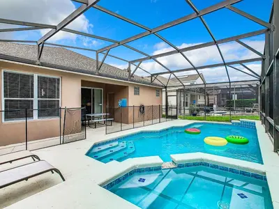 a swimming pool with two frisbees in it at T8134-Windsor Palms Resort Pool and Spa Near Disney in Kissimmee