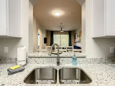a kitchen with a sink and a counter top at C2785-203-Windsor Hills Resort Free Water Park Themed Rooms in Orlando