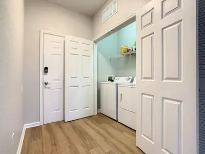 a white door in a room with a kitchen at C2785-203-Windsor Hills Resort Free Water Park Themed Rooms in Orlando