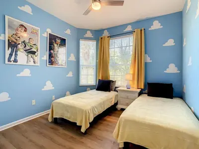 two beds in a room with blue walls at C2785-203-Windsor Hills Resort Free Water Park Themed Rooms in Orlando