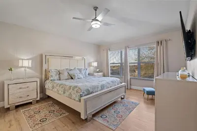 a bedroom with a bed and a ceiling fan at 6Q/4B | Piscina Privativa | Sala de Jogos Avengers in Orlando