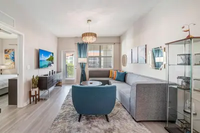 a living room with a couch and a table at Vista Cay by CY -Harry Potter 3BR in Orlando