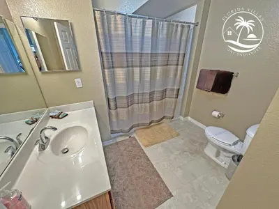 a bathroom with a sink and a toilet and a shower at Standard four beds Villas Seven Dwrafs - Close to Disney in Kissimmee