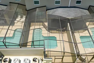 an aerial view of a building with a staircase at Villa Smile - 4Q/3B Storey Lake *Casa Luxuosa* in Kissimmee