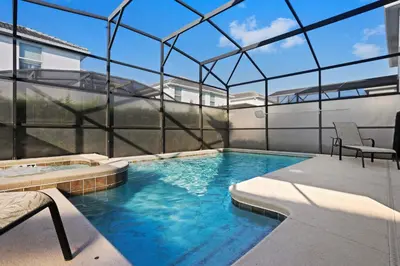 a swimming pool in a house with a glass ceiling at 4718 Sleepy Hollow Drive in Kissimmee