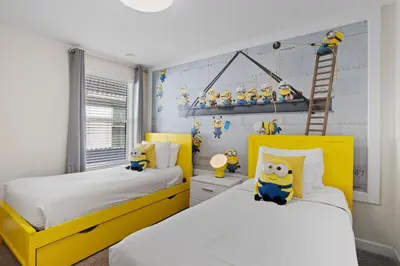 a bedroom with two yellow beds and a ladder at 4718 Sleepy Hollow Drive in Kissimmee