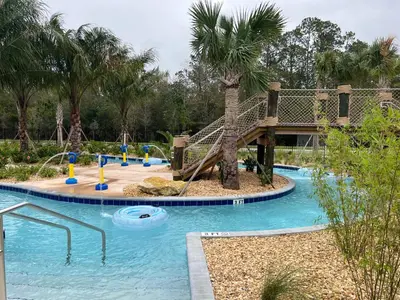 a playground with a slide in a resort at Enchanted Orlando Getaway, 10 minutes from Disney in Kissimmee