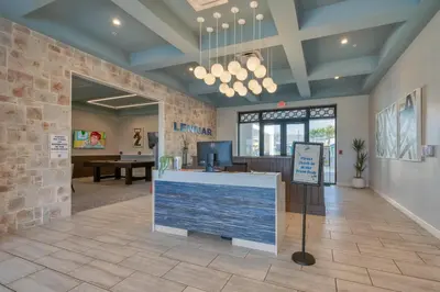 a lobby of a store with a counter and a table at Disney Getaway Prime Location Themed Rooms in Kissimmee