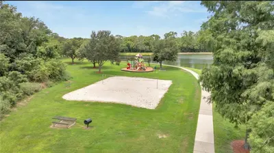 an aerial view of a park with a bench and a playground at Resort Community 4 Bedroom Family Home, Pool & 15 Min Disney in Kissimmee