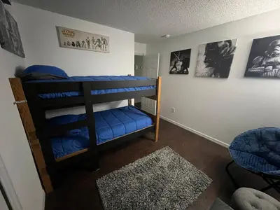 a bedroom with two bunk beds in a room at Resort Community 4 Bedroom Family Home, Pool & 15 Min Disney in Kissimmee