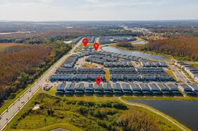 an aerial view of a parking lot with red signs at 2912 Storey Lake new game room 24 guests poolspa in Kissimmee
