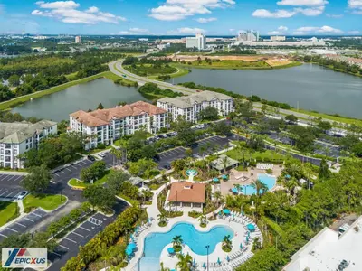 an aerial view of the resort with a lake and buildings at The Epic Chicago Vista Cay Orlando in Orlando