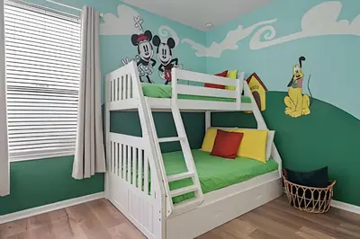 a bedroom with a bunk bed with mickey mouse mural at Casa Luxo 4Q c/ Piscina e Game Room Avengers in Orlando