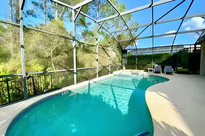 a swimming pool in a house with a glass ceiling at 6Q/5.5B Luxo Piscina Priv. Disney in Kissimmee
