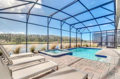 an indoor swimming pool with a glass roof at Brand New House Private Lake View 3009 Protagonist home in Kissimmee