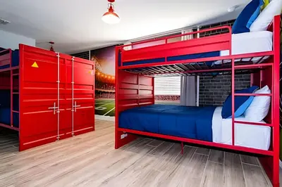 a bedroom with red bunk beds and a brick wall at 6BD/4BA Windsor Hills | Sala de Jogos & Piscina in Orlando