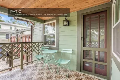 a balcony with a table and chairs on a house at Lake House in Orlando