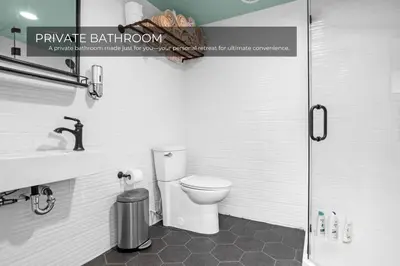 a bathroom with a toilet and a sink and a shower at Lake House in Orlando