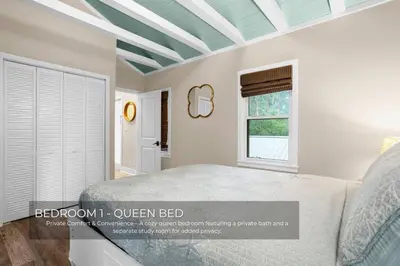 a bedroom with a bed and a window at Mills Cottage in Orlando
