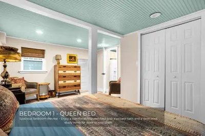 a bedroom with a white door and a room with a dresser at Mills Lakeside in Orlando