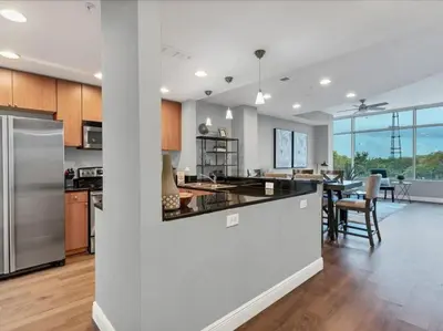 an open kitchen and dining area of a house at Luxury 1260sq ft 2 Bd 2BTH in DT in Orlando