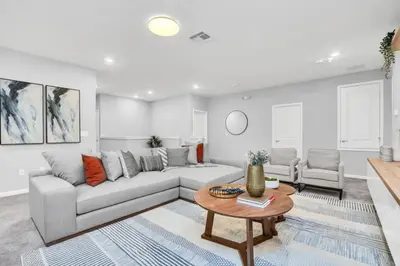 a living room with a couch and a table at Dynamic 15 Bed With Character Bedrooms Pool, Spa! villa in Kissimmee
