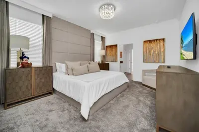 a bedroom with a large white bed in a room at 2900Penolpe home in Kissimmee