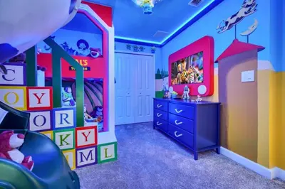a childs room with a colorful room with a slide at 2900Penolpe home in Kissimmee
