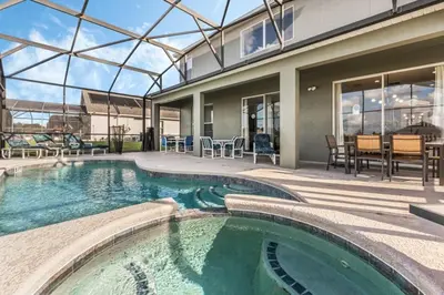 a swimming pool in the middle of a house at Emerald Island Large 8 Bed Home Golf Resort villa in Kissimmee