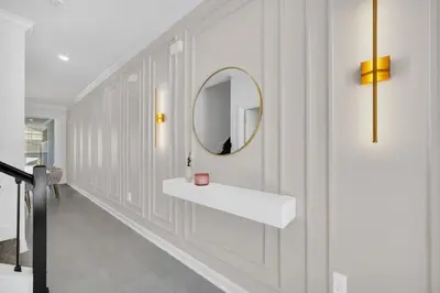 a bathroom with a sink and a mirror on the wall at Luxury 4 Bedroom Storey Lake Townhome 2444Reading townhouse in Kissimmee