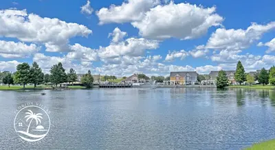 a view of a lake with houses in the background at Deluxe 4 bedrooms Villa at Seven Dwrafs Resort - Close to Disney in Kissimmee