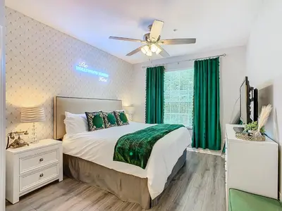 a bedroom with a bed and a ceiling fan at Windsor Hills Cozy 3 BR Condo, Starwars, By Disney in Orlando