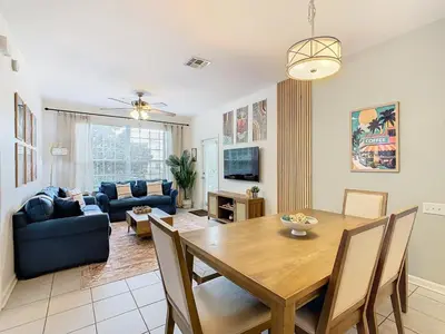 a living room with a table and a couch at Windsor Hills Cozy 3 BR Condo, Starwars, By Disney in Orlando