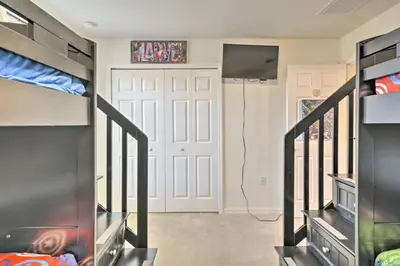 a room with a white door and a closet at Look over Nature, Pool Home Near Disney Parks in Kissimmee