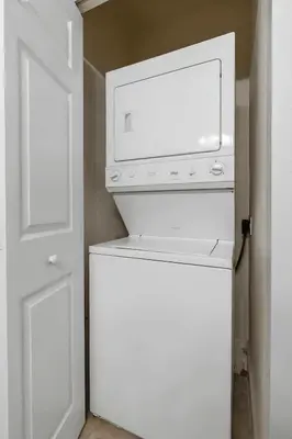 a white refrigerator with a microwave on top of it at Casa 3Q/2B – Região Disney com Piscina Privada in Kissimmee