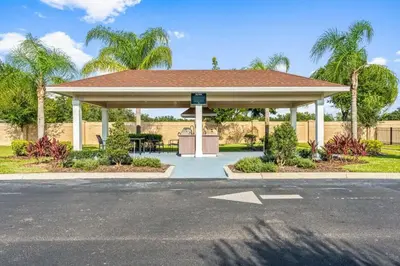 a gazebo with a picnic table in a park at 3200- Aconchegante casa de 4 Quartos com Acesso ao resort, Próxima à Disney in Kissimmee